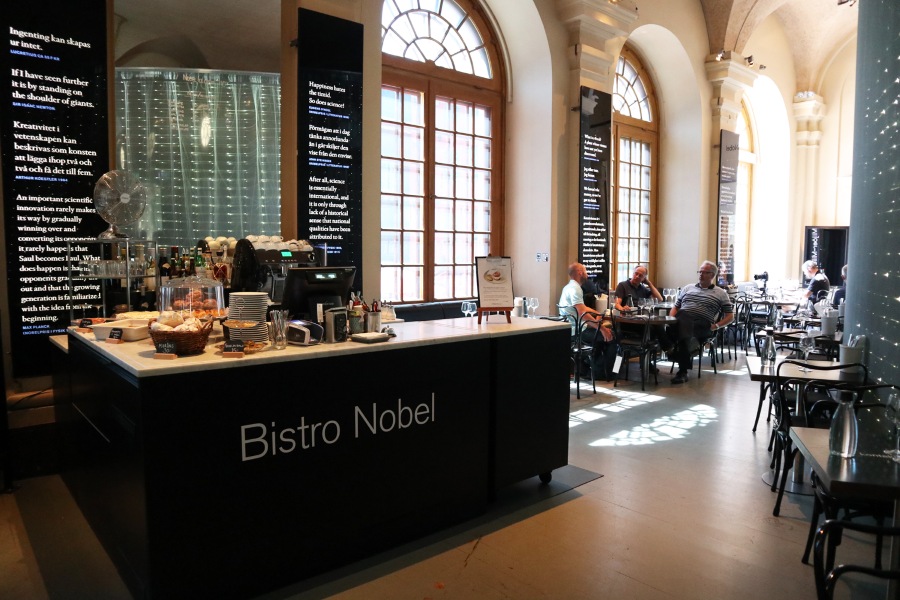 Inside Bistro Nobel—think cozy corners, Laureate‑signed chairs, and plenty of sunlight for your fika.